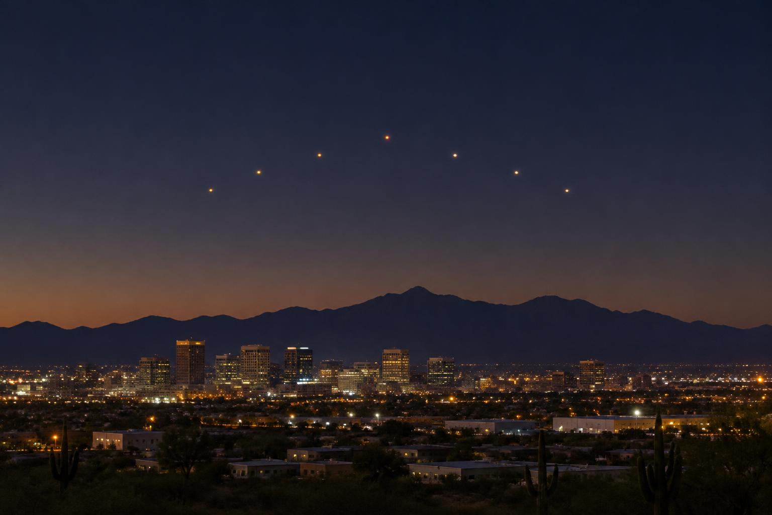 Illustration of lights above the Phoenix skyline; not an original 1997 photograph