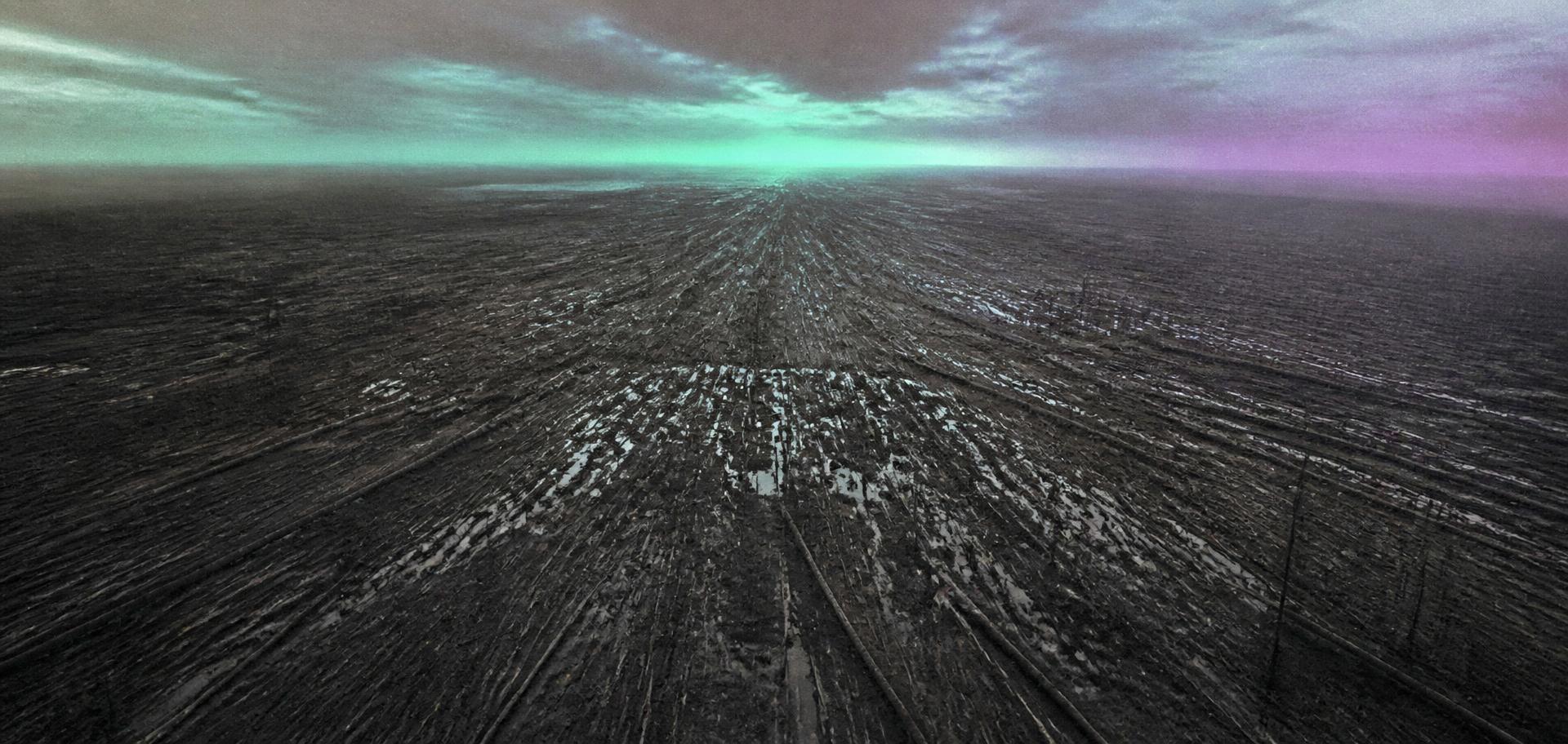 Vast Siberian taiga with millions of flattened scorched pine trees radiating outward under a cold dawn sky